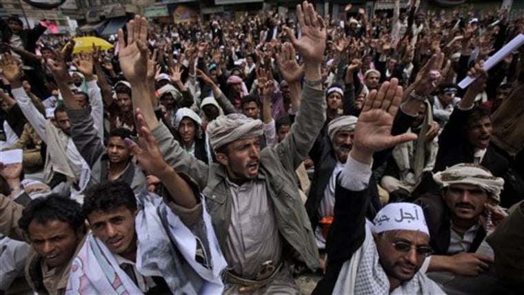 Anti-government protestors gesture, while chanting slogans during a demonstration demanding the resignation of Yemeni President Ali Abdullah Saleh, in Sanaa, Yemen, on Saturday.